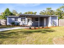 Charming single-story home with a well-maintained lawn and a covered front entry at 1062 Reams St, Longwood, FL 32750