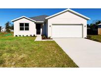 New construction home with attached garage and front yard at 3180 Riverhead Dr, Deltona, FL 32738