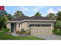 Charming single-story home with a large garage, well-maintained lawn, and beautiful landscaping at 9116 Wildlight Trl, Wildwood, FL 34785