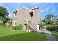 Charming two-story home with neutral siding, white trim and a welcoming front entrance at 5929 Windhover Dr # A02, Orlando, FL 32819