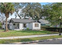 Charming bungalow with a newly painted exterior and landscaped lawn at 400 Raehn St, Orlando, FL 32806