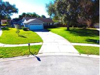 Single-story house with a large front yard and driveway at 5124 Timber Ridge Trl, Ocoee, FL 34761