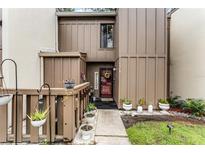 Inviting exterior with landscaped walkway and charming entryway at 5316 Pebble Beach Dr # E, Orlando, FL 32811