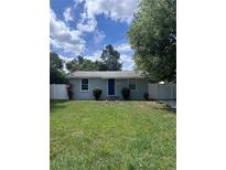 Charming single-story home featuring a well-maintained lawn, cute shrubs, and white privacy fence at 110 Oleander Ave, Auburndale, FL 33823