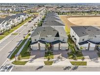 Excellent aerial view of new construction townhomes in a well-planned community in Florida at 953 Splash Shot Pl # 953, Davenport, FL 33896