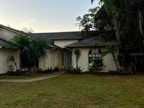 One-story house with a landscaped lawn and walkway at 245 Rosita Dr, Debary, FL 32713