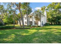 Stunning two-story home with lush landscaping and a grand entrance, showcasing curb appeal at 109 E 12Th Ave, Windermere, FL 34786
