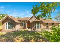 Charming single-story home with a well-maintained lawn and inviting facade at 45 Sackett Rd, Debary, FL 32713
