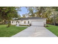 Charming single-story home features a well-manicured lawn and a two-car garage at 632 Oakhurst St, Altamonte Springs, FL 32701