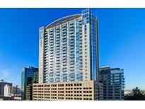 High rise building exterior in a city setting with blue skies at 155 S Court Ave # 2908, Orlando, FL 32801