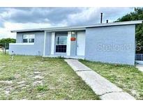 Charming single-story home with a well-maintained lawn and inviting entrance at 2302 E Dana Dr, Deltona, FL 32738