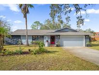 Charming single-story home featuring a well-maintained front yard and attractive stone accents at 1608 Bomi Cir, Winter Park, FL 32792