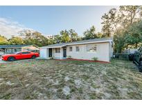Newly renovated home with a spacious front yard at 1307 Pine Lake Rd, Orlando, FL 32808
