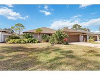 Well-maintained home exterior featuring a large yard at 7 Huntley Ct., Haines City, FL 33844