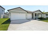 Charming single-Gathering home with a well-manicured lawn, two-car garage and a modern design at 2316 Citrus Bloom Dr, Bartow, FL 33830
