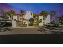 Inviting condo building with lush landscaping and ample parking at 459 Hamptoncrest Cir # 103, Lake Mary, FL 32746