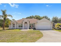 Charming single-story home with manicured lawn, inviting entrance, and two-car garage in a desirable location at 3871 Dallas Blvd, Orlando, FL 32833