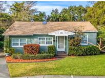 Charming light-green house with well-maintained landscaping at 811 Briercliff Dr, Orlando, FL 32806