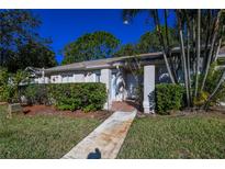 Neat condo with a well-manicured lawn and walkway at 1207 Lucaya Cir, Orlando, FL 32824