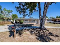 Updated single story home with a covered porch and well-manicured lawn at 1639 Hialeah St, Orlando, FL 32808