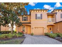 Two-story townhome with attractive facade, driveway, and landscaping at 1260 Long Oak Way, Sanford, FL 32771