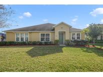 One-story house with a green door and well-maintained lawn at 218 Black Springs Ln, Winter Garden, FL 34787
