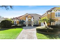 Luxury home with tile roof and landscaped yard, in upscale neighborhood at 1519 Lake Rhea Dr, Windermere, FL 34786