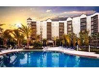 Resort-style pool and sundeck area with luxurious amenities at 14501 Grove Resort Ave # 3135, Winter Garden, FL 34787