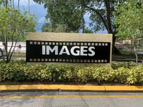 Community entrance sign with landscaping at 5291 Images Cir # 204, Kissimmee, FL 34746