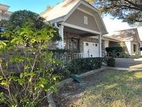 Brick house with a covered porch and well-maintained landscaping at 9378 Sw 90Th Ct # B, Ocala, FL 34481