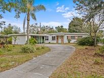 Charming ranch home with circular driveway and mature landscaping at 2007 Natalen Rd, Winter Park, FL 32792