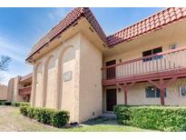 Inviting exterior showcasing the home's unique architectural details and a well-manicured landscape at 2868 N Powers Dr # 5, Orlando, FL 32818