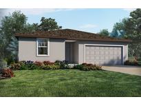 One-story home with gray siding, brown roof, and landscaped yard at 2303 White Tail St, Davenport, FL 33837