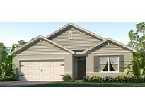 One-story home with a light beige exterior, two-car garage, and landscaping at 7116 Painted Bunting Way, Saint Cloud, FL 34773