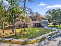 Attractive single-story home with a large yard and driveway at 223 Royal Oaks Cir, Longwood, FL 32779
