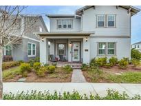 Two-story house with front porch and landscaping at 13384 Leggett Aly, Orlando, FL 32827