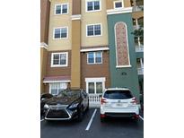 Building exterior with parking and landscaping at 8749 The Esplanade # 29, Orlando, FL 32836