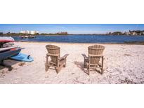 Relaxing waterfront sandy beach with chairs at 4113 Fairview Vista Pt # 208, Orlando, FL 32804