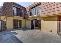Private patio with adjacent sliding glass doors at 5341 Bamboo Ct # 418, Orlando, FL 32811