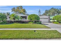 Charming ranch home with well-manicured lawn and attractive landscaping at 3306 Florene Dr, Orlando, FL 32806