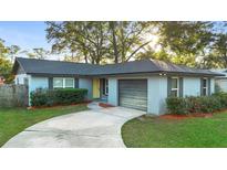 Cute ranch home with a large yard and driveway at 328 E Hillcrest St, Altamonte Springs, FL 32701