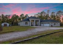 Stunning ranch home with detached garage and expansive lot at 720 Napoli Ln, New Smyrna Beach, FL 32168