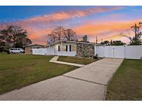 Updated Ranch home with long driveway, fenced yard, and sunset views at 1413 Evangeline Ave, Orlando, FL 32809