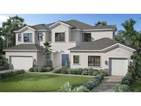 Two-story house with a light-colored facade, two-car garage, and landscaping at Lot 20 Yellowleaf Cir, Orlando, FL 32820