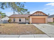 Inviting single-story home with attached garage and well-maintained lawn at 1004 Chance Cv, Oviedo, FL 32765