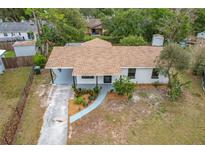 Newly renovated home with landscaped yard and driveway at 1630 Smithfield E Cir, Lakeland, FL 33801