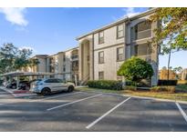 Condo building with parking and landscaping at 2705 Maitland Crossing Way # 5-107, Orlando, FL 32810