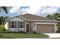 One-story home with a two-car garage and landscaping at 1216 White Ash Loop, Deland, FL 32720