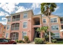 Two-story condo building with inviting entryway and landscaping at 13536 Turtle Marsh Loop # 538, Orlando, FL 32837