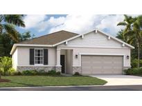 One-story home with a neutral color palette and landscaping at 1212 White Ash Loop, Deland, FL 32720